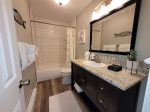Bathroom with vanity and hair dryer
